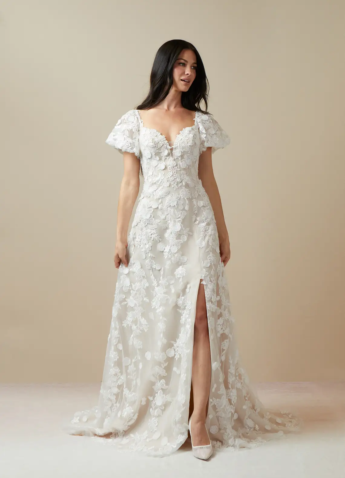 Puff short sleeve lace bridal gown with leg slit. 